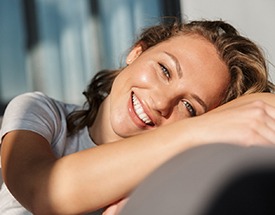 woman smiling after getting veneers in Canton 