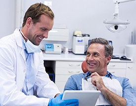 Man smiling during consultation for dental implants in Canton
