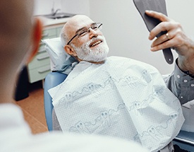 Man smiling in dental chair 