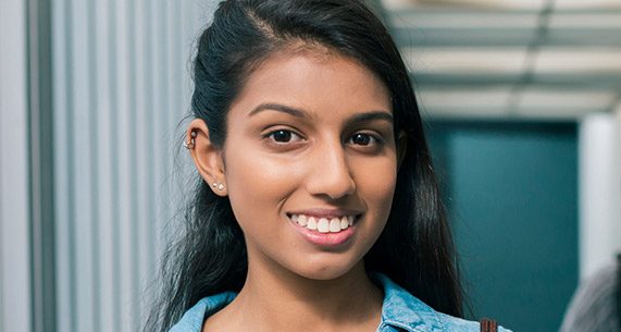 Young girl with straight healthy smile