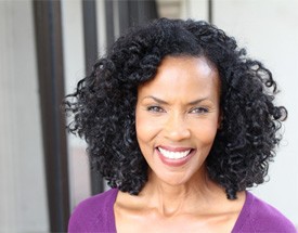 woman smiling with dental bridge in Canton 