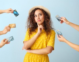 Woman surrounded by credit cards 