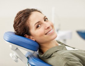 patient smiling after getting dental crown in Canton