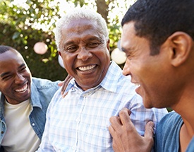 Patient in Canton smiling with dentures