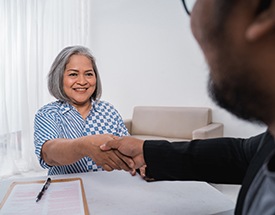 Patient in Canton shaking hands with employer