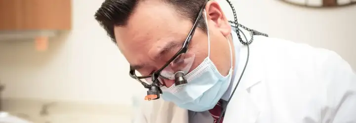 Dentist treating patient