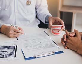 dentist going over payment options with a patient