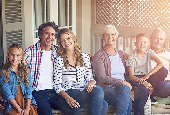 Smiling family on front porch