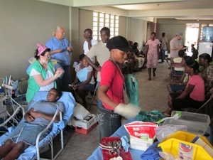 Team working on rows of patients