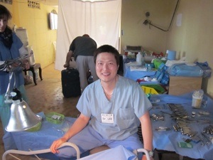 Dr. Brian Lee with patients in tent