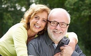 Senior couple smiling outdoors