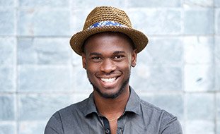 Young man with straight healthy teeth