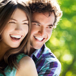 happy couple smiling thanks to the hickory flats dentists