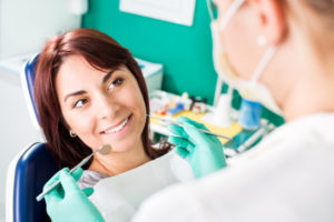 Smiling woman at dentist
