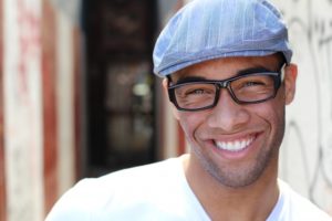 man smiling wearing clear braces