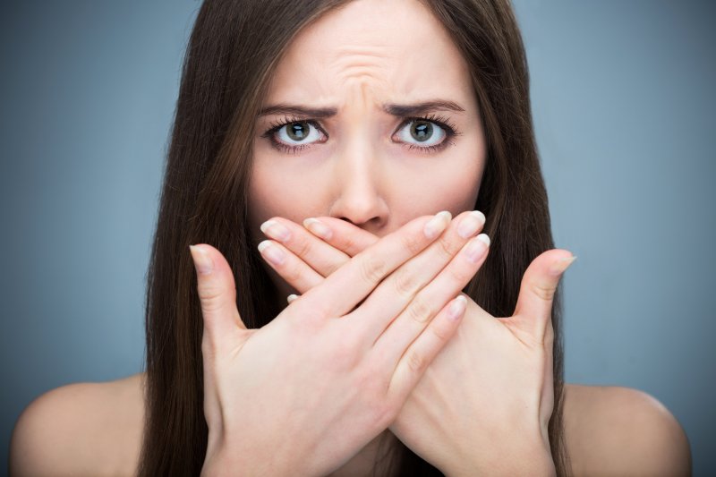 Woman with loose tooth