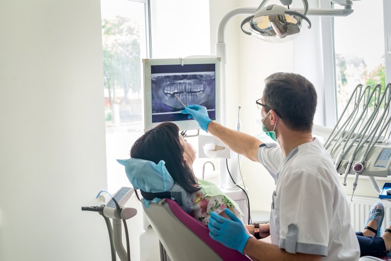 Dentist explaining X-ray to patient