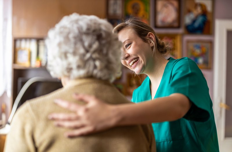 Older woman with dentist for seniors