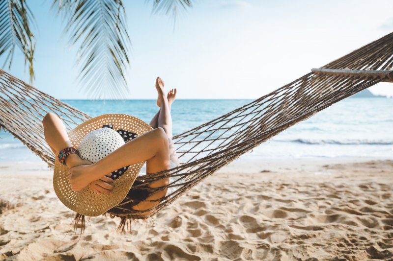 woman lounging in a hammock